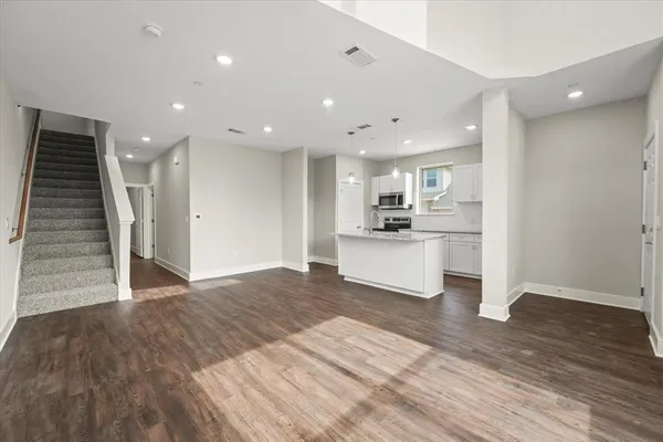 a view of kitchen with sink and wooden floor