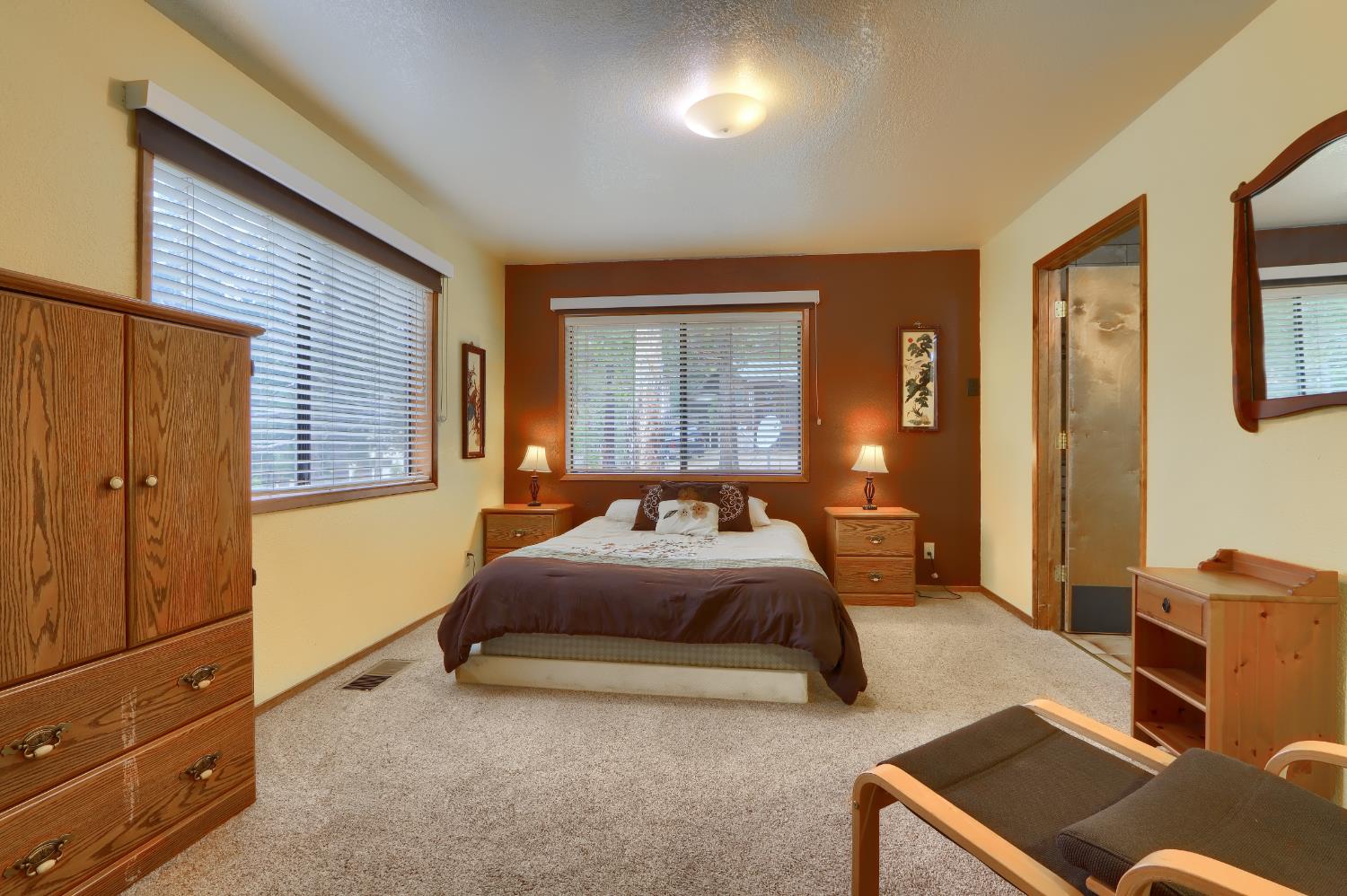 8041 Chilnualna Falls Road Wawona, CA 95389 - Photo 20 of 46 a bedroom with a bed and wooden floor