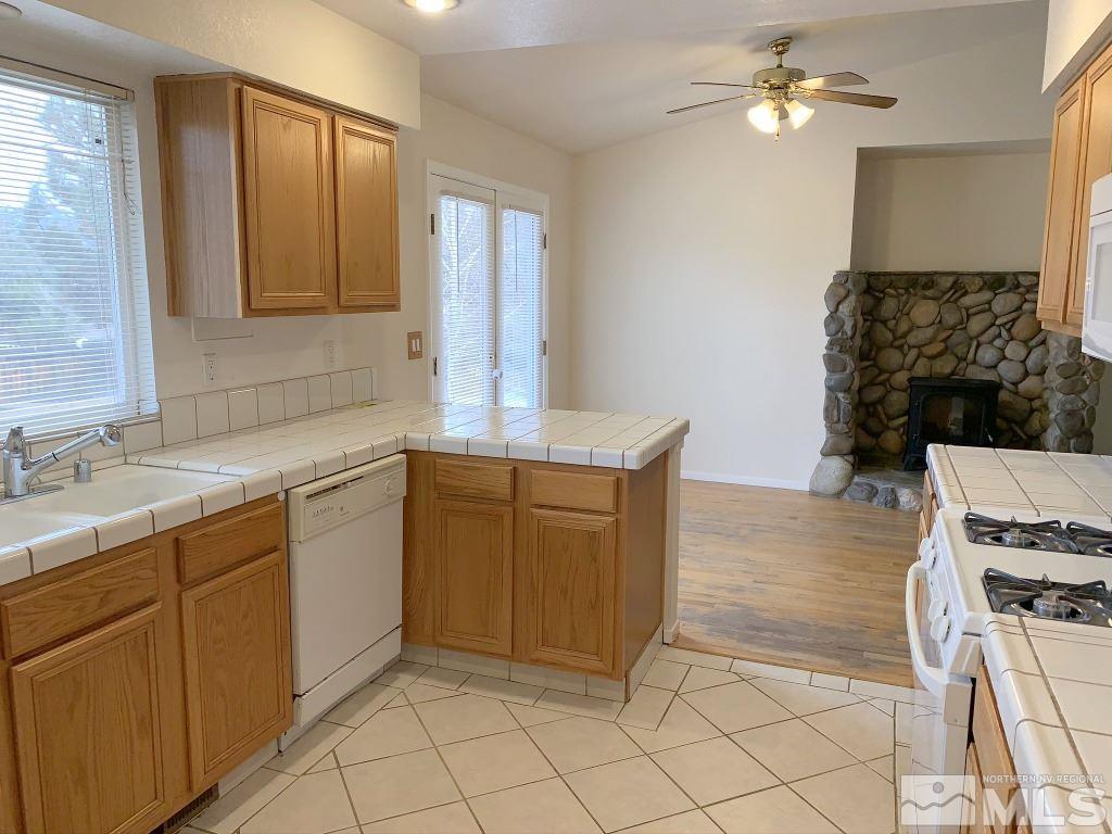 14400 Ghost Rider Drive Reno, NV 89511 - Photo 7 of 17 a kitchen with a sink cabinets and window