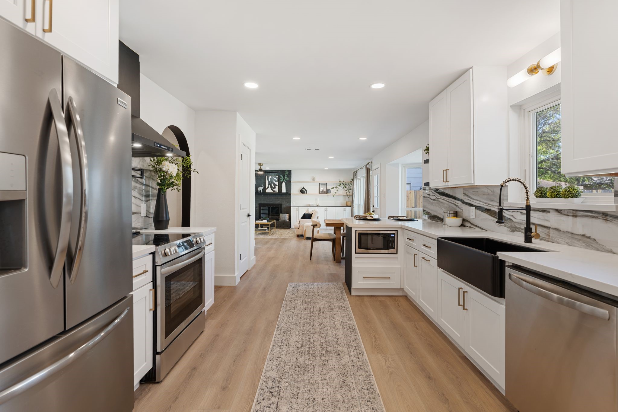 6902 Stoney River Drive Spring, TX 77379 - Photo 12 of 32 Featuring top-of-the-line Frigidaire appliances, this kitchen is equipped with a sleek 5-burner stove and a convection oven, perfectly designed to inspire your inner chef.