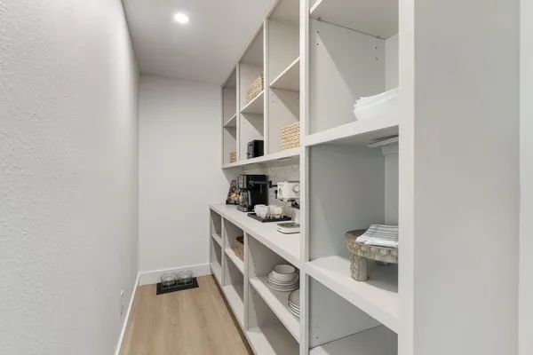 a hallway with cabinets