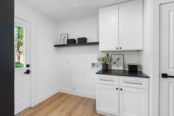 a view of cabinets and wooden floor
