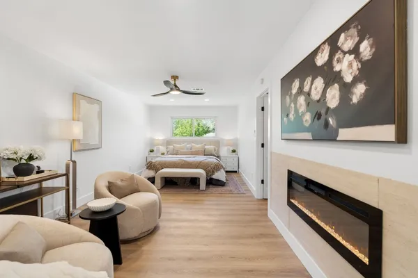 a living room with furniture and a fireplace
