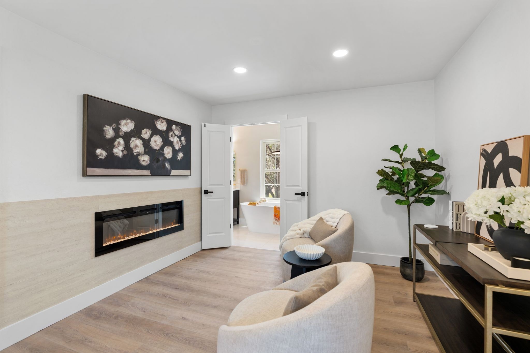 6902 Stoney River Drive Spring, TX 77379 - Photo 20 of 32 This haven offers a cozy sitting area anchored by an in-wall fireplace, setting the stage for ultimate relaxation.