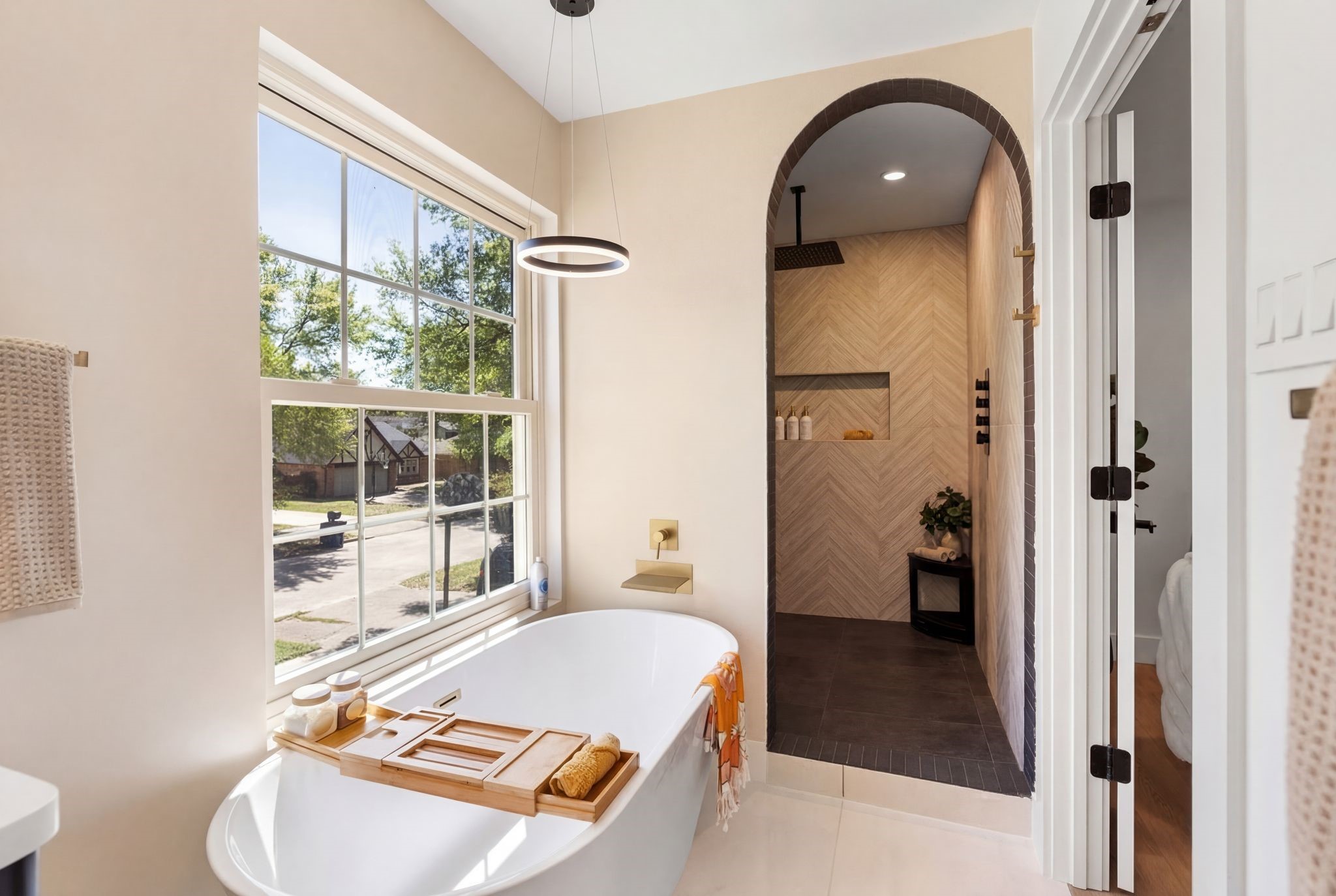 6902 Stoney River Drive Spring, TX 77379 - Photo 23 of 32 This free standing soaking tub with waterfall faucet and overhead chandelier is designed to deliver an indulgent experience.