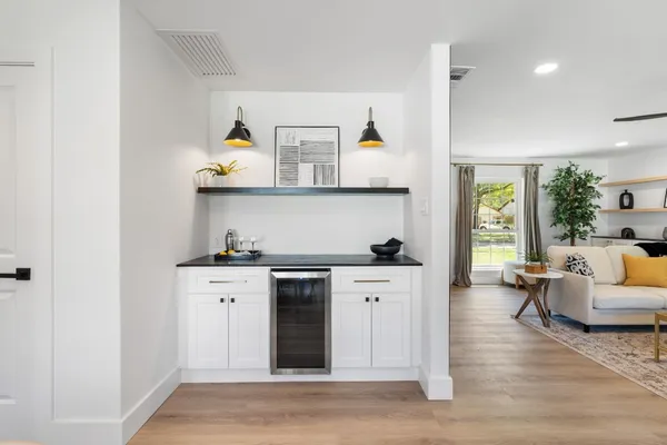 a kitchen with stainless steel appliances granite countertop a stove and a refrigerator