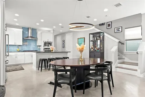 a view of kitchen with dining table and chairs