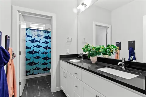 a bath room with a sink and a mirror