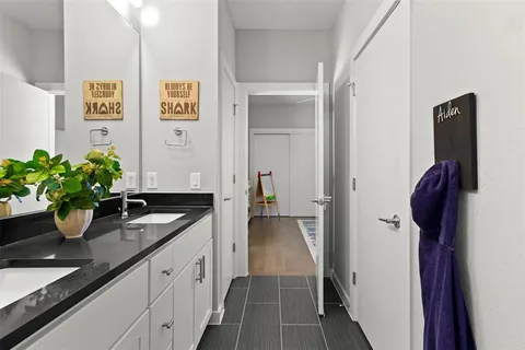 a bathroom with sink and mirror