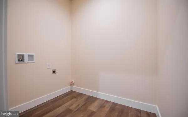 a view of a small space with wooden floor