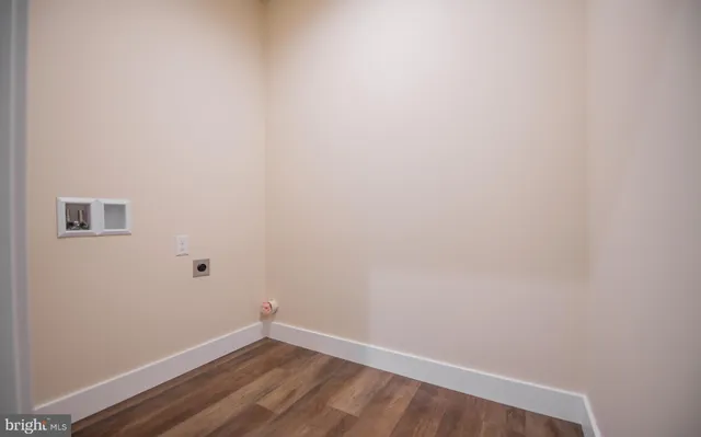 a view of a small space with wooden floor