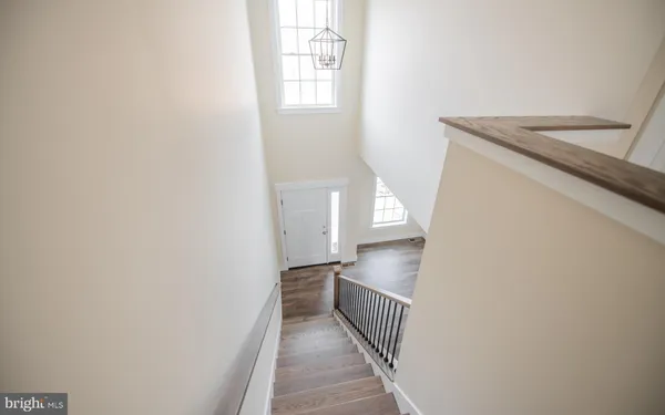 a view of a kitchen from the stairs