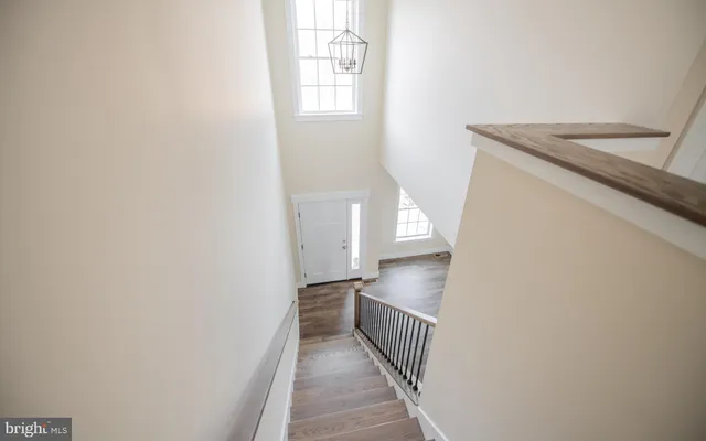 a view of a kitchen from the stairs