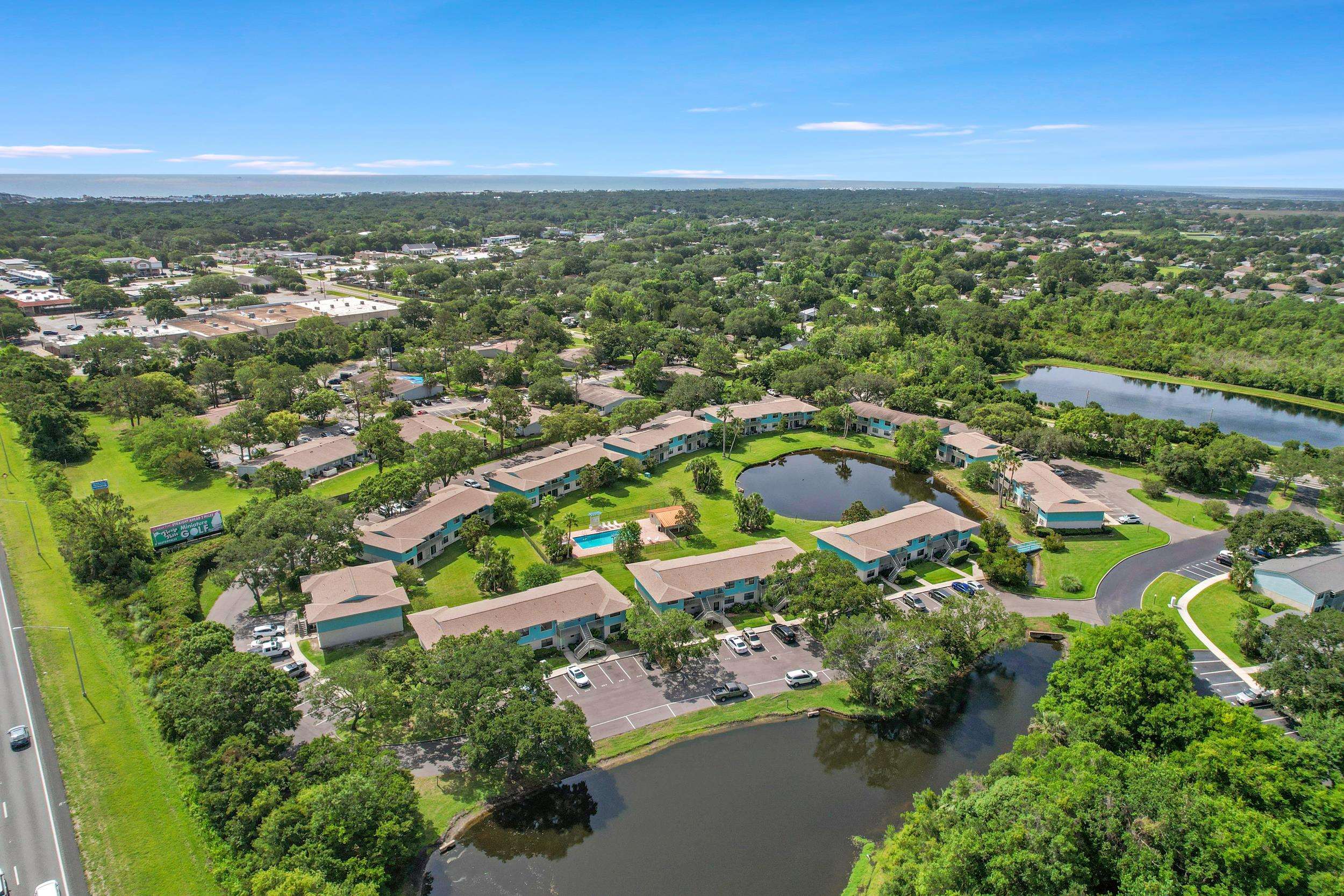 650 West Pope Road, Unit 265 St. Augustine, FL 32080 - Photo 13 of 32 an aerial view of residential houses with outdoor space and trees