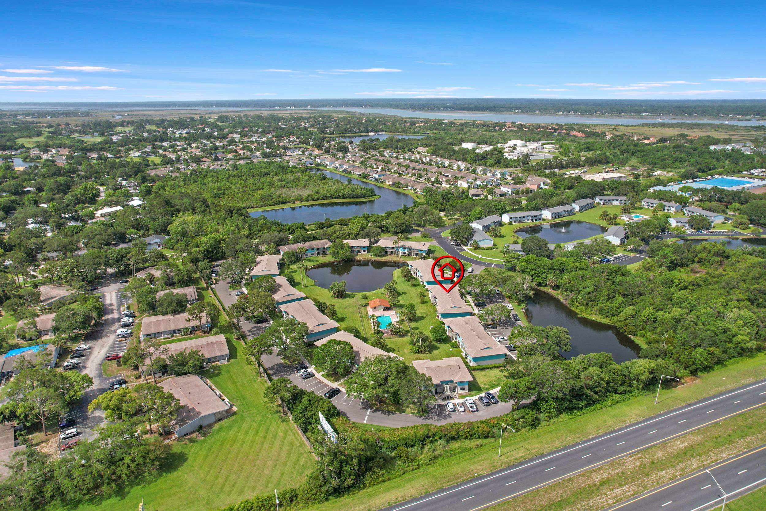 650 West Pope Road, Unit 265 St. Augustine, FL 32080 - Photo 17 of 32 an aerial view of residential houses with outdoor space and trees