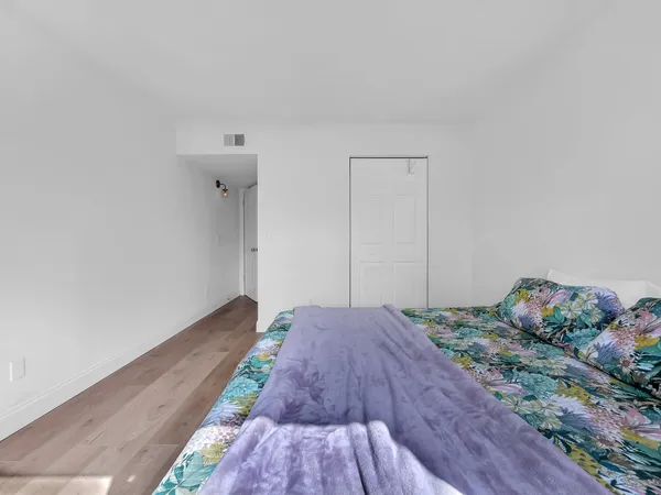 a view of a chairs and table in patio with a lake view
