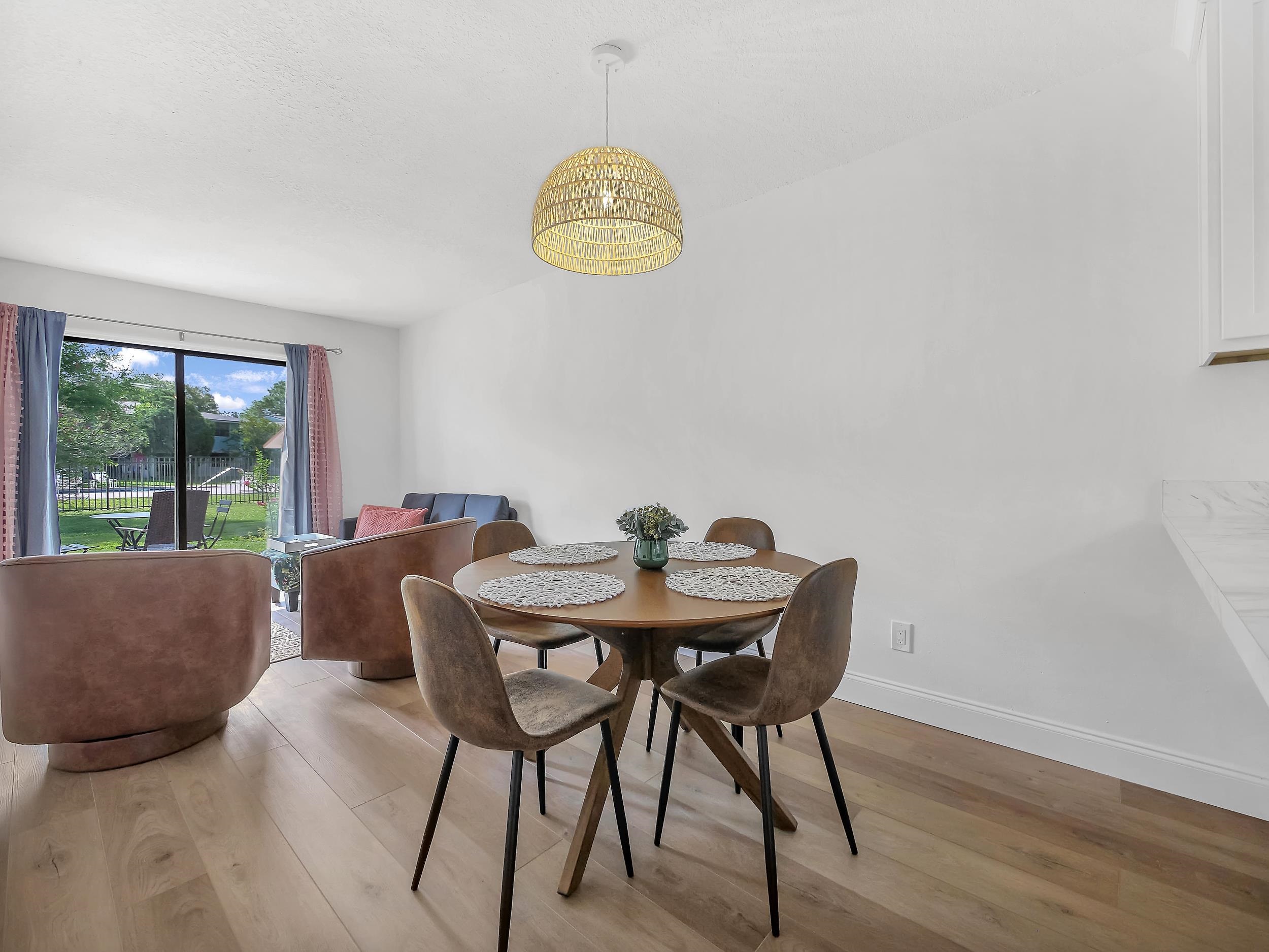 650 West Pope Road, Unit 265 St. Augustine, FL 32080 - Photo 29 of 32 a view of a dining room with furniture and a window