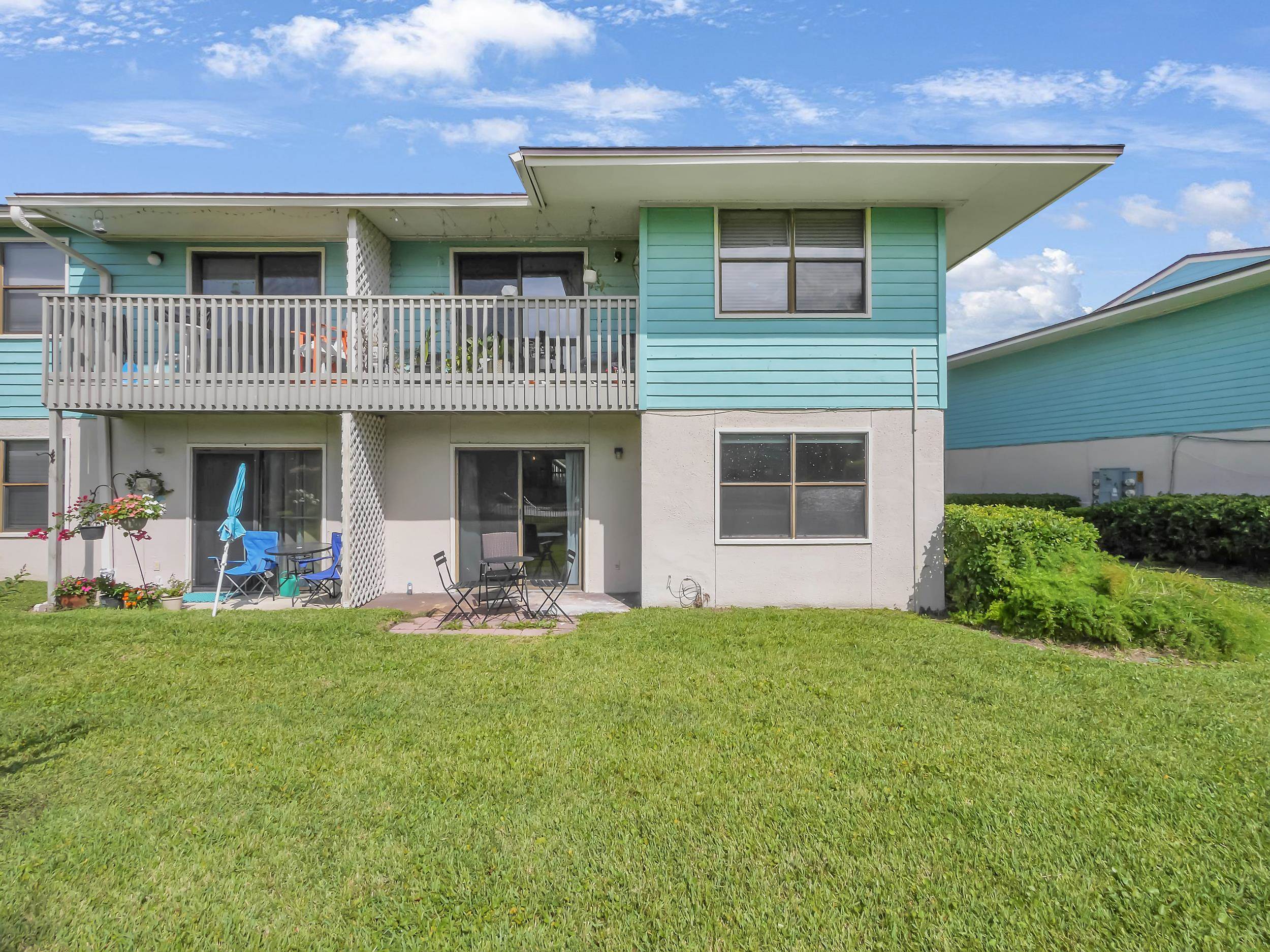 650 West Pope Road, Unit 265 St. Augustine, FL 32080 - Photo 30 of 32 a front view of a house with a yard