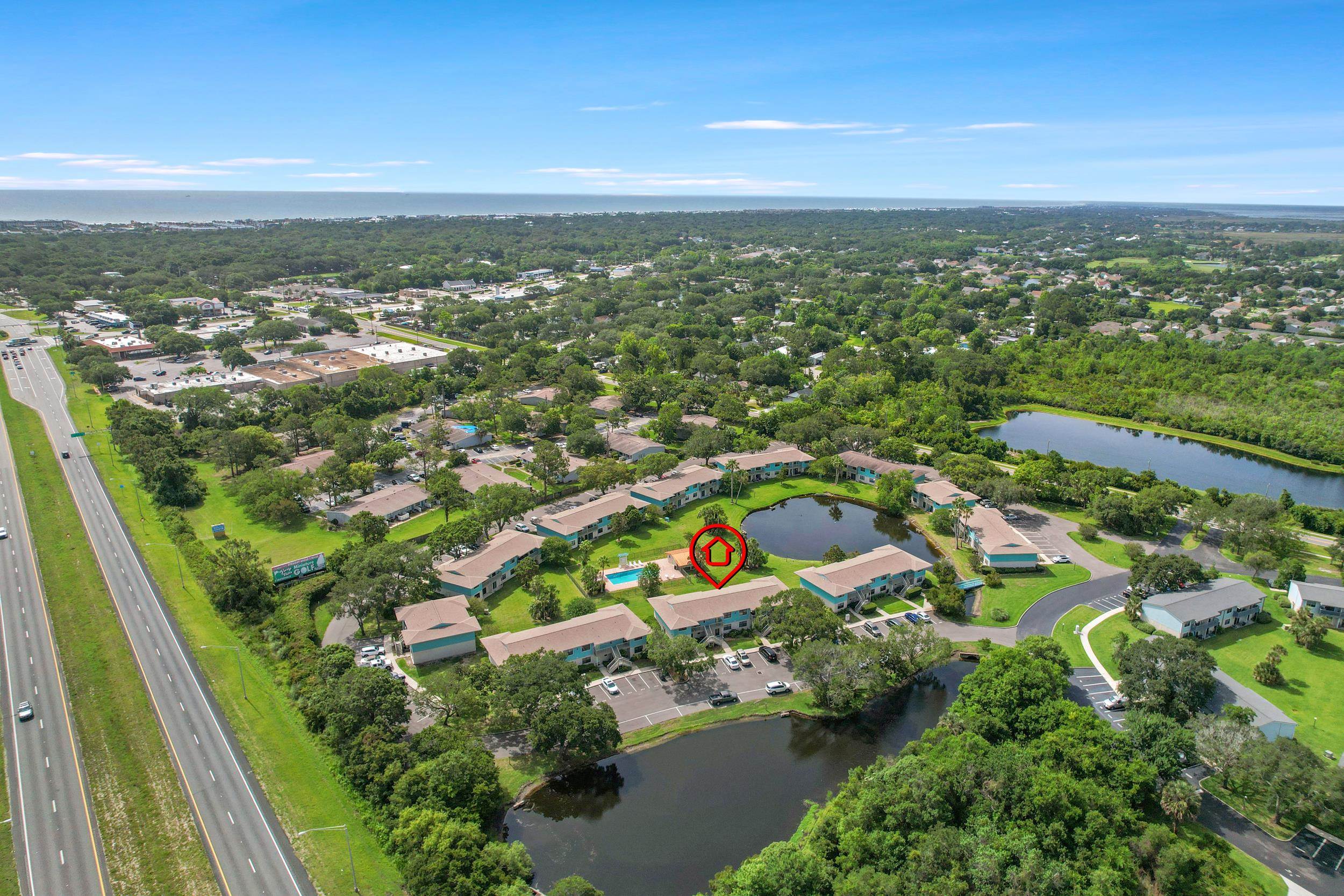 650 West Pope Road, Unit 265 St. Augustine, FL 32080 - Photo 32 of 32 an aerial view of residential houses with outdoor space