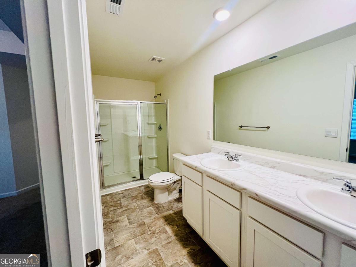 2678 Paxton Place Decatur, GA 30034 - Photo 16 of 22 a spacious bathroom with a shower sink and toilet