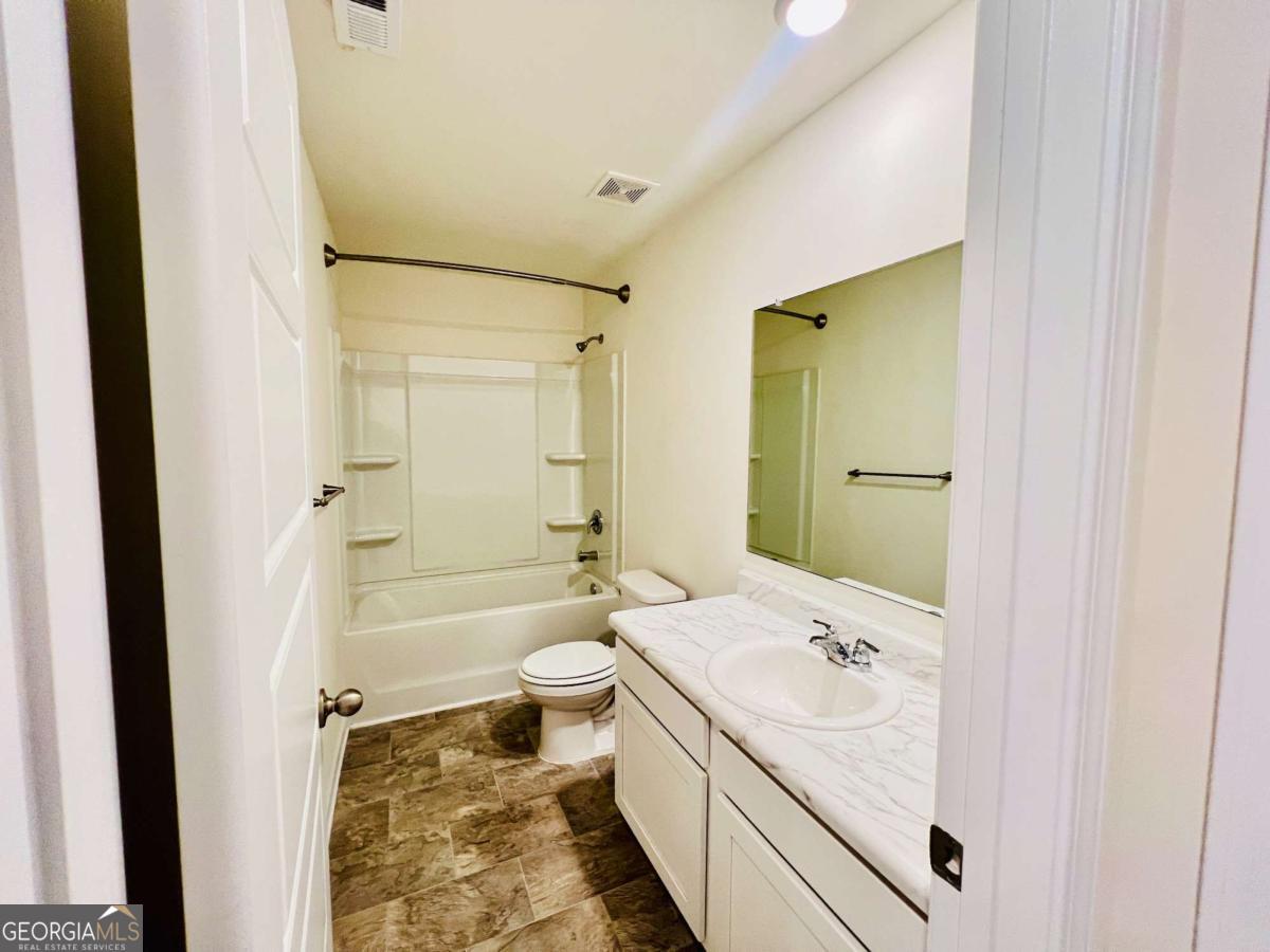 2678 Paxton Place Decatur, GA 30034 - Photo 20 of 22 a bathroom with a sink a toilet and shower