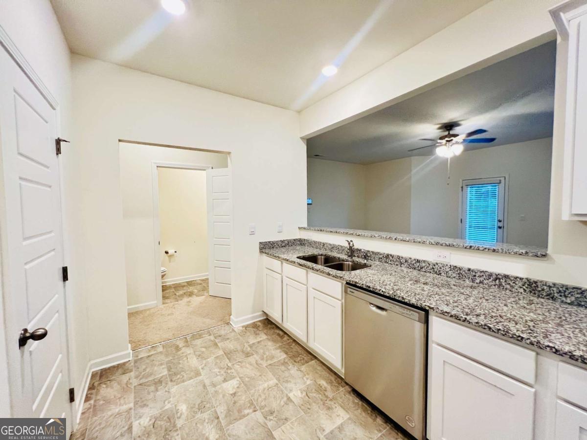 2678 Paxton Place Decatur, GA 30034 - Photo 7 of 22 a kitchen with granite countertop a sink and a stove