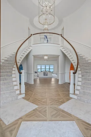 a dining room with furniture a rug and wooden floor