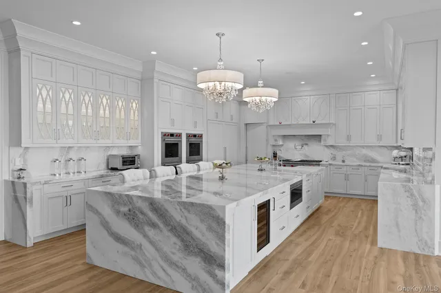 a bedroom with a bed and glass wall