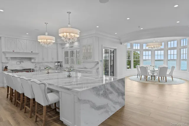 a view of a chair and table in a living room next to a window