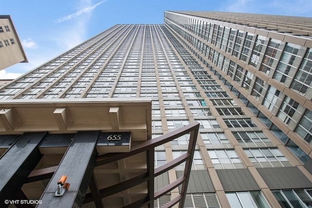 655 West Irving Park Road, Unit 707 Chicago, IL 60613 - Photo 13 of 13 a view of a balcony with wooden floor