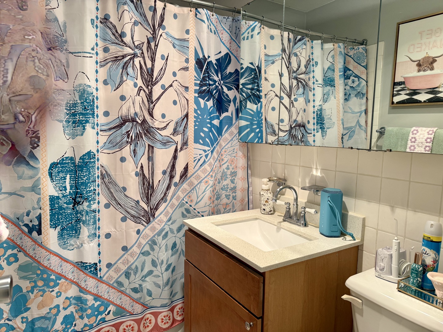 655 West Irving Park Road, Unit 707 Chicago, IL 60613 - Photo 10 of 13 a bathroom with a sink and a mirror