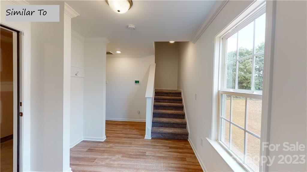 1118 Baileys Chapel Road Advance, NC 27006 - Photo 6 of 10 a view of a hallway with wooden floor and entryway