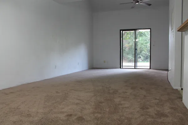 an empty room with closet area