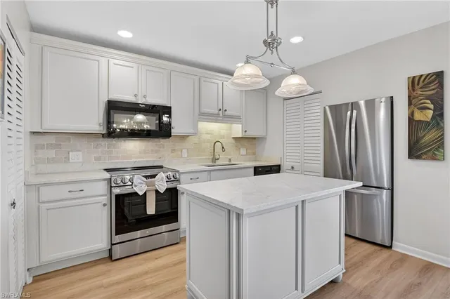 a kitchen with a stove and a microwave