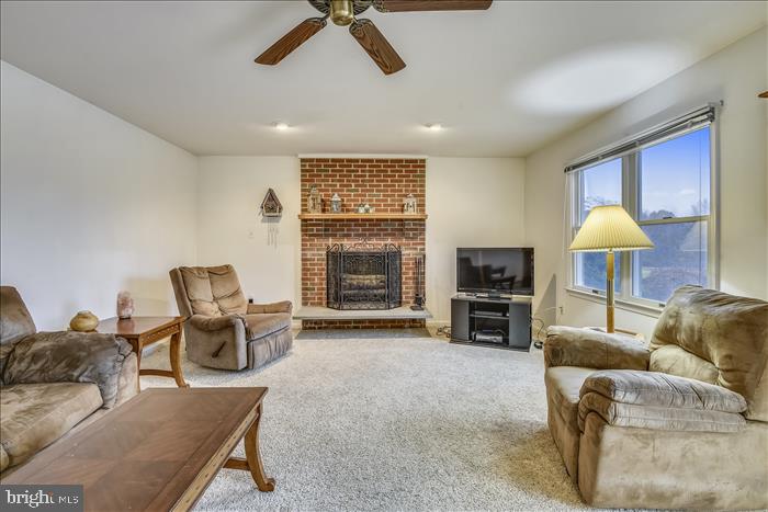 35 Old Solomons Island Road Lothian, MD 20711 - Photo 15 of 43 Cozy wood burning fireplace with brick surround