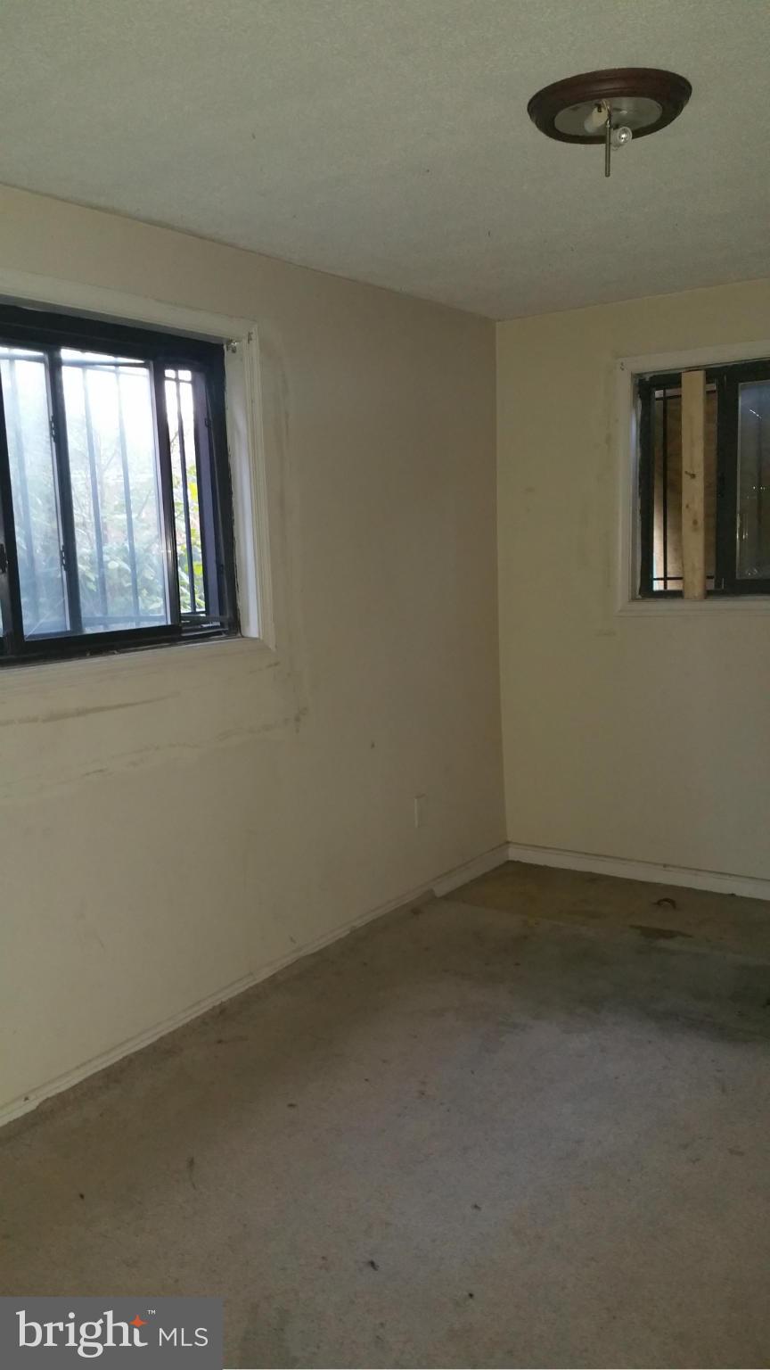 1617 Butler Street Southeast Washington, DC 20020 - Photo 7 of 16 an empty room with windows