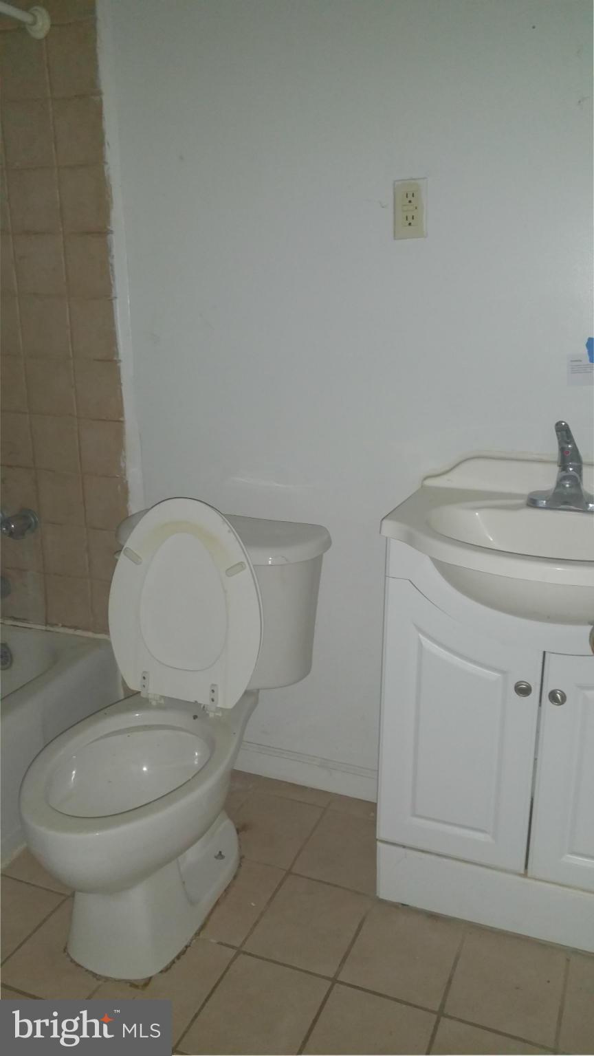 1617 Butler Street Southeast Washington, DC 20020 - Photo 10 of 16 a white toilet sitting next to a bathroom sink