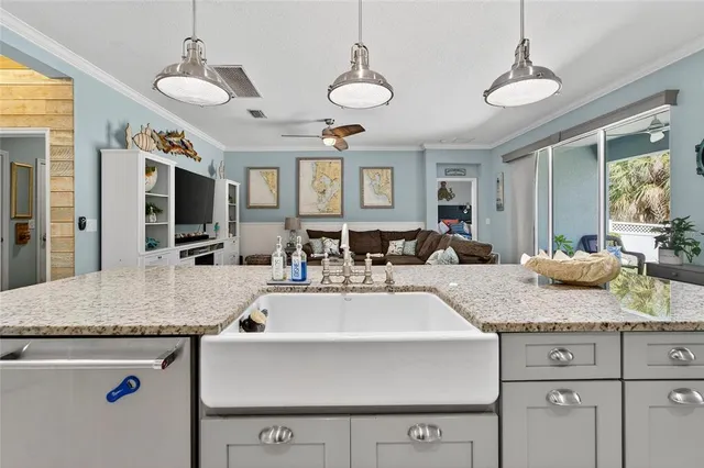 a bathroom with a granite countertop toilet sink and mirror