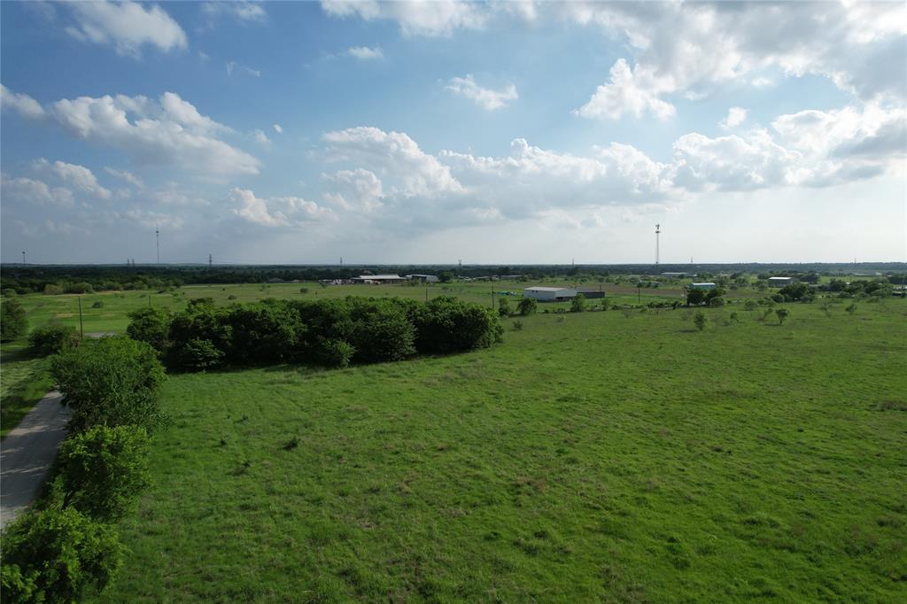 1 Bounds Road, Unit 110 Gunter, TX 75058 - Photo 9 of 10 a view of a field of grass and trees
