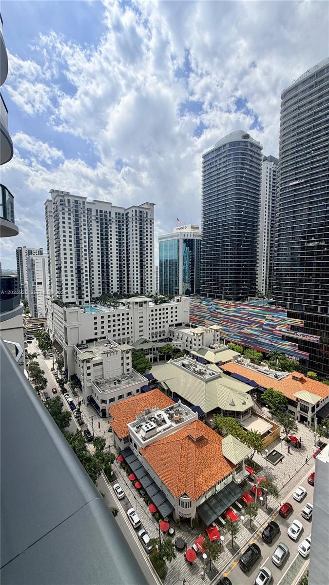 1000 Brickell, Unit 2014 Miami, FL 33131 - Photo 28 of 30 a view of swimming pool with a lounge chairs
