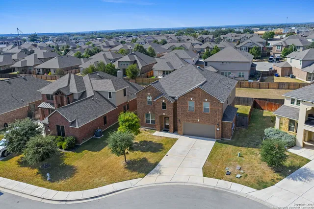 an aerial view of a house with a garden