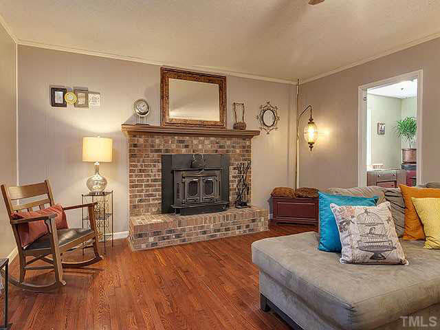 5229 Guess Road Durham, NC 27712 - Photo 8 of 25 Fireplace is a beautiful focal point of the living room. Living Room