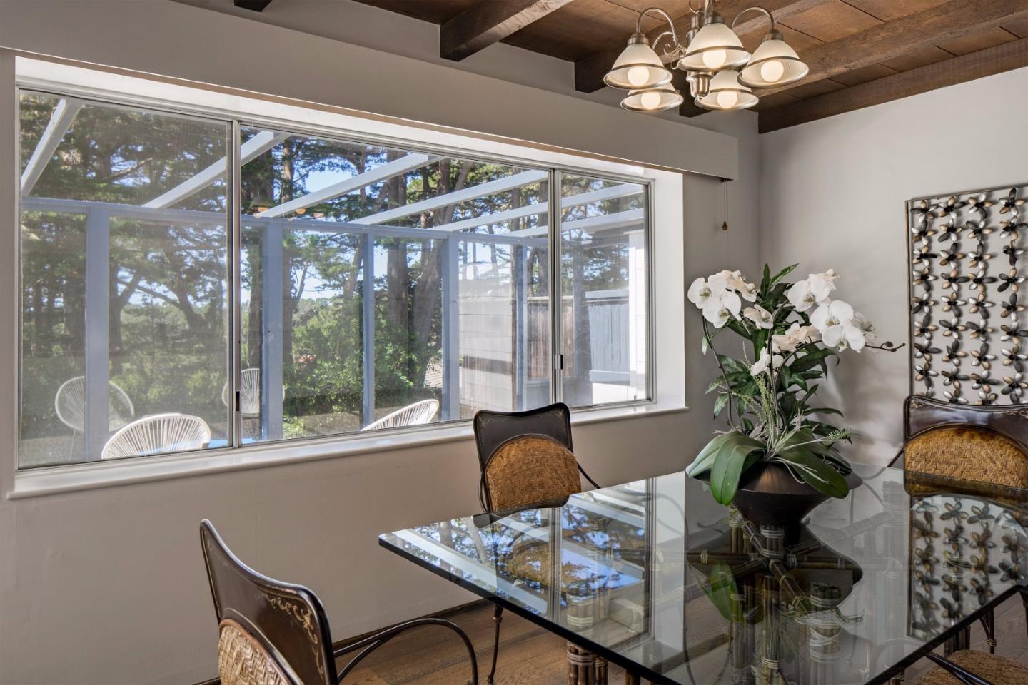 4122 Sunridge Road Pebble Beach, CA 93953 - Photo 8 of 22 a table room with furniture and chandelier