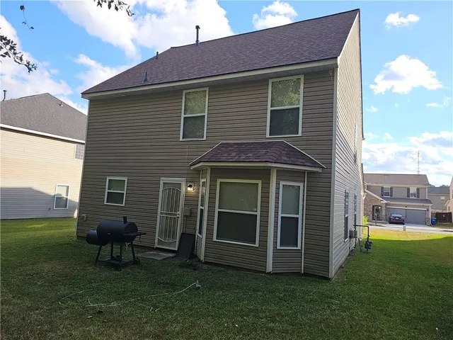 a view of a house with a garden