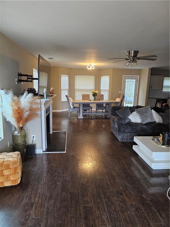 3503 Ebb Circle Fairburn, GA 30213 - Photo 5 of 12 a living room with couches and kitchen view with wooden floor