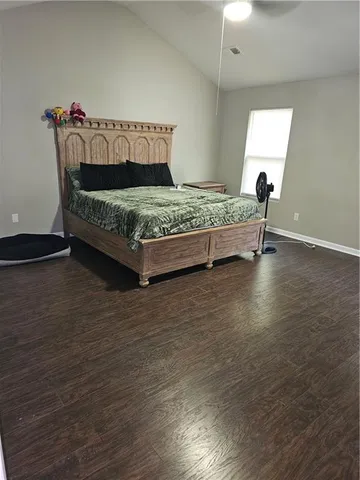 a bedroom with a bed and a table in it
