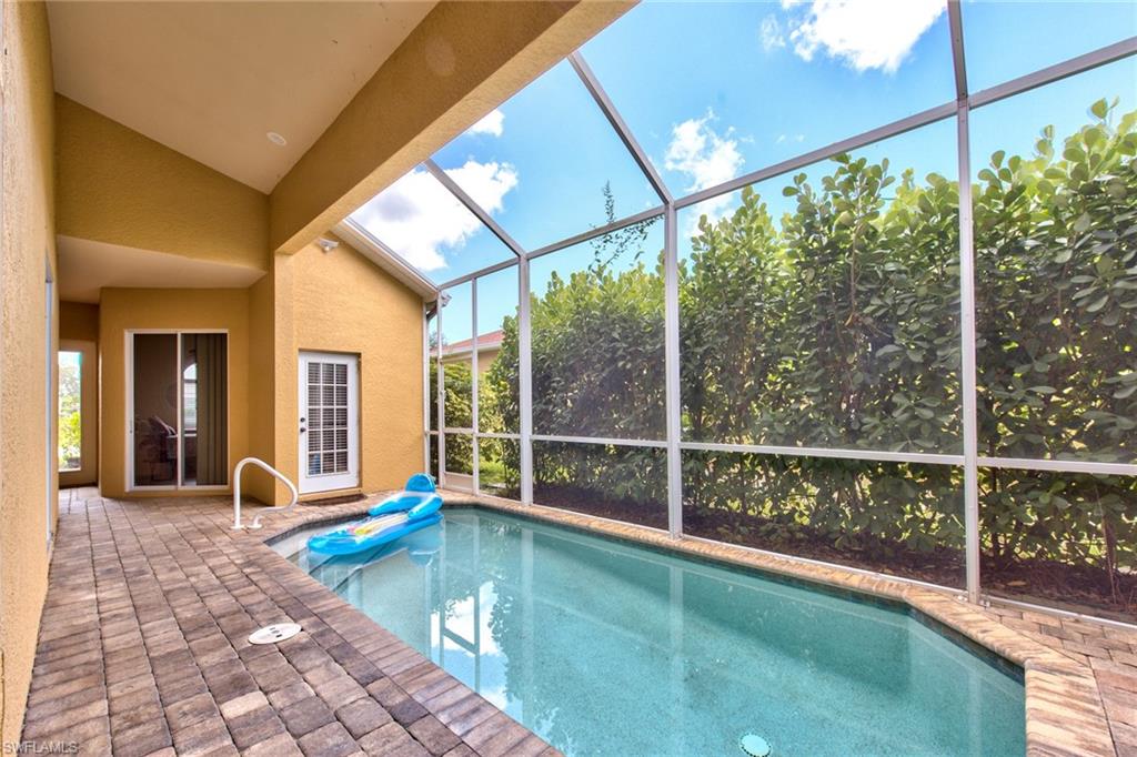 a view of swimming pool with seating space