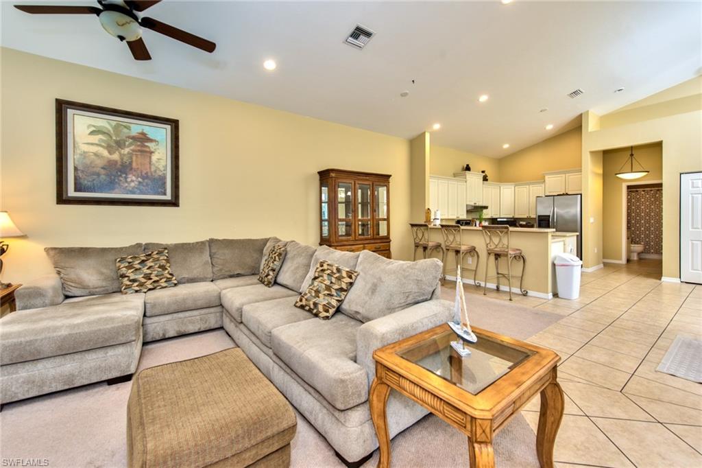 3748 Kent Drive Naples, FL 34112 - Photo 11 of 30 a living room with furniture and kitchen view