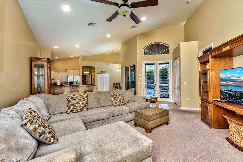 3748 Kent Drive Naples, FL 34112 - Photo 12 of 30 a living room with furniture and a flat screen tv