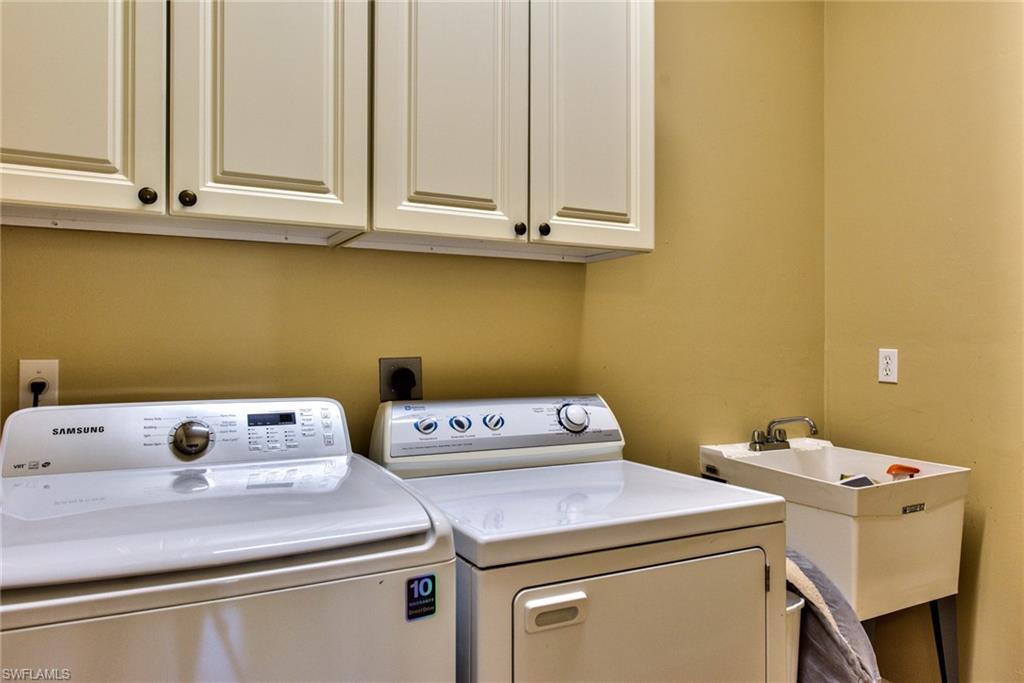 3748 Kent Drive Naples, FL 34112 - Photo 17 of 30 a utility room with dryer and washer